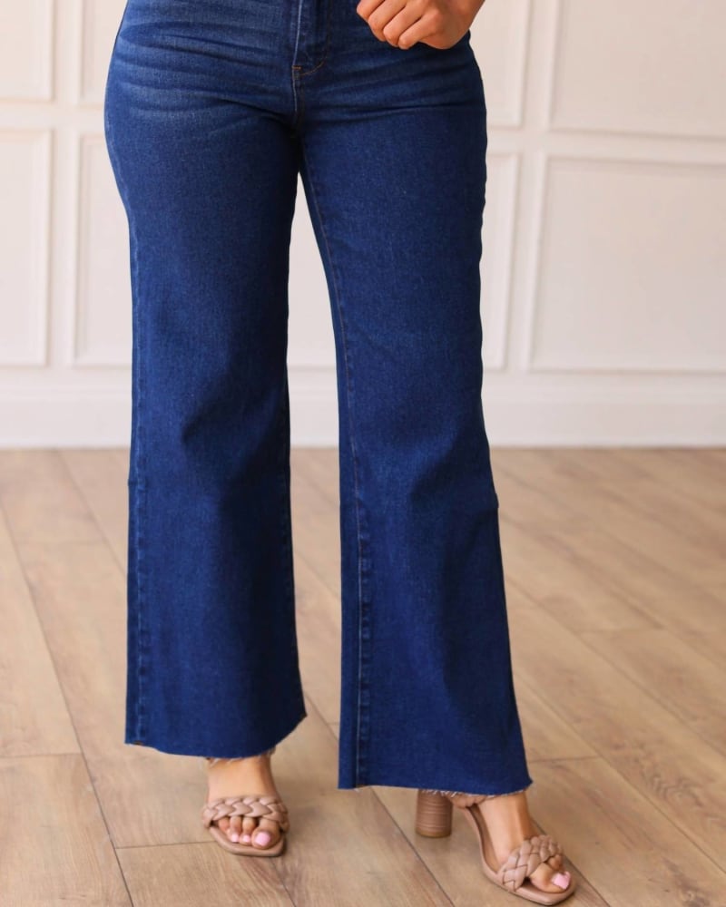 Front of a model wearing a size 14 The Dakota High Rise Wide Leg With Fray Hem Denim In True Blue in True Blue by Southern Grace. | dia_product_style_image_id:356445